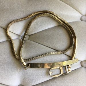 Vintage 1960s gold tone metal non-elastic belt.
